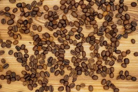 Coffee beans. Coffee beans background. Coffee Concept. On a wooden background. Stock Photos