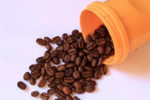 Coffee beans in coffee container isolated on white. Foto stock