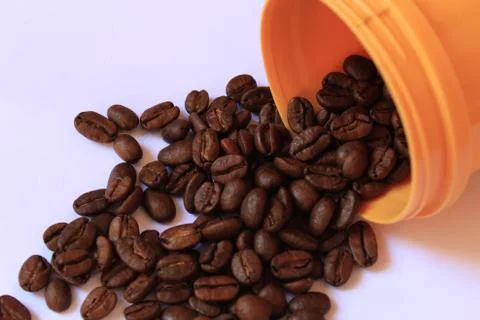 Coffee beans in coffee container isolated on white. Foto stock