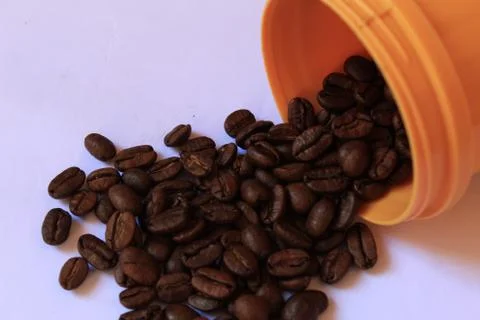 Coffee beans in coffee container isolated on white. Foto stock