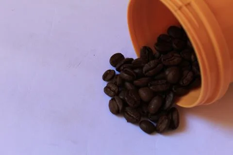 Coffee beans in coffee container isolated on white. Foto stock