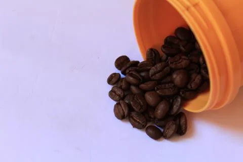 Coffee beans in coffee container isolated on white. Foto stock