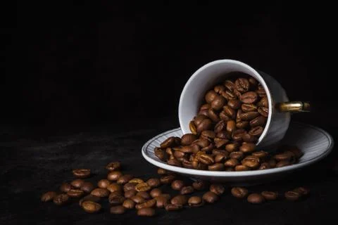 Coffee beans in a coffee cup.  Stock Photos