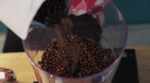 Coffee beans in a coffee grinder Видео 58262129