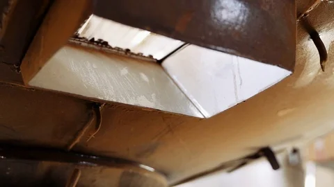 Coffee beans cooled after roasting are poured from the drum into the container. Video stock 121034182