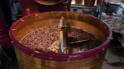Coffee beans cooling in a brass roaster. Stock Footage 331316498