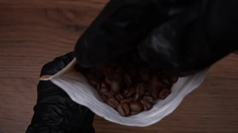Coffee Beans in Craft Packaging in Human Hands Stock Footage 263912585