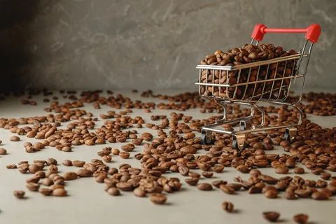 Coffee beans create a unique shopping experience in a metallic cart Stock Photos