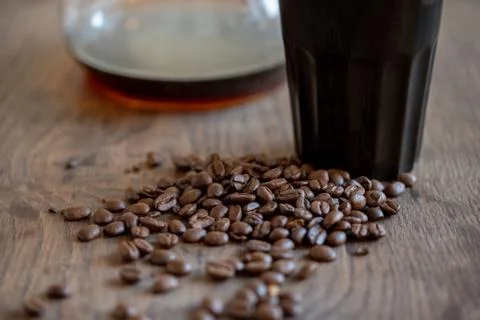 Coffee beans in cup on beans background Stock Photos