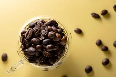 Coffee beans in a cup isolated on plain background Foto stock
