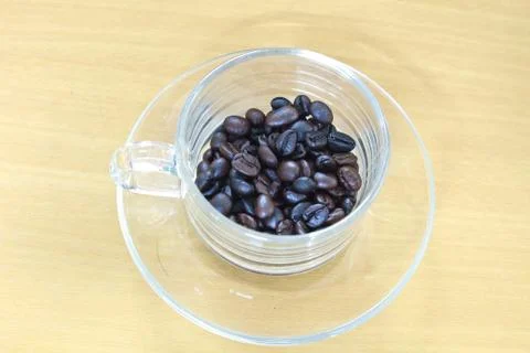 Coffee beans in cup Stock Photos