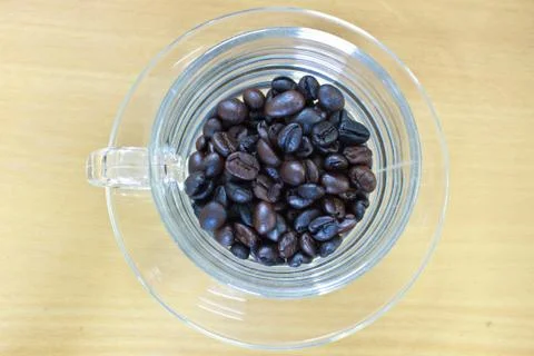 Coffee beans in cup Stock Photos