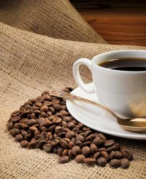 Coffee beans with cup Stock Photos