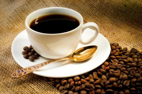 Coffee beans with cup Stockfoto's