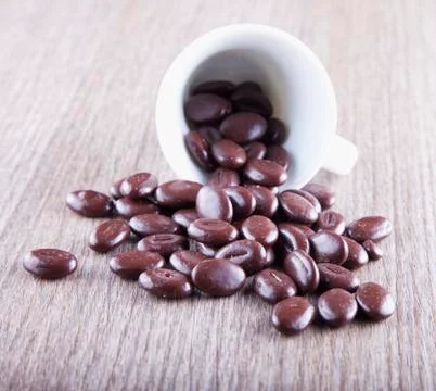 Coffee beans in cup Stock Photos