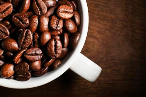 Coffee beans in cup Stock Photos