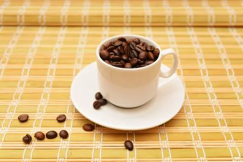Coffee beans in a cup Stock Photos