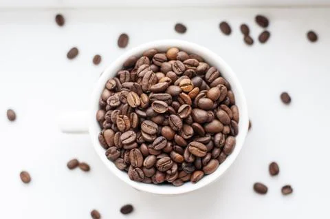 Coffee beans in a cup 스톡 사진