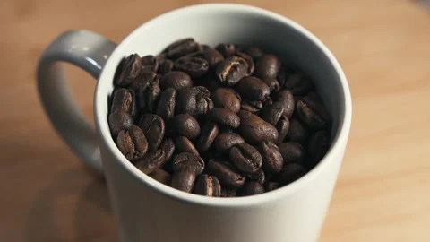 Coffee beans in a cup rotating side light Stock Footage 263137904