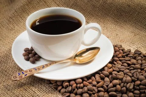 Coffee Beans with Cup A warm cup of coffee with coffee beans Copyright: xZ... Stock-Fotos