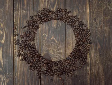 Coffee beans on dark background, top view, copyspace. Stock Photos