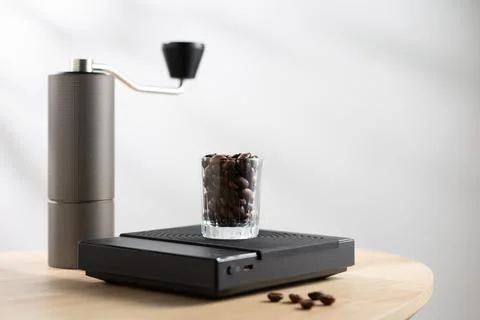 Coffee beans on a digital scale Stock Photos
