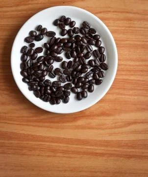 Coffee beans on a disk . Stock Photos