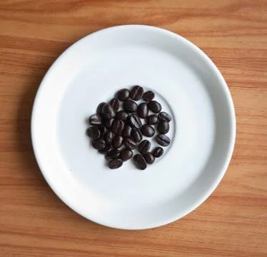 Coffee beans on a disk . Foto stock