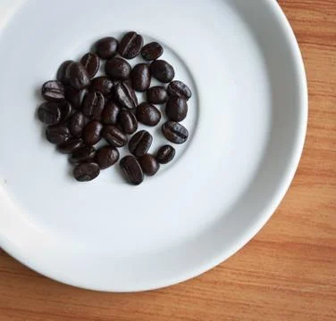 Coffee beans on a disk . Fotos Stock