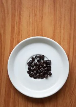 Coffee beans on a disk . Stock Photos