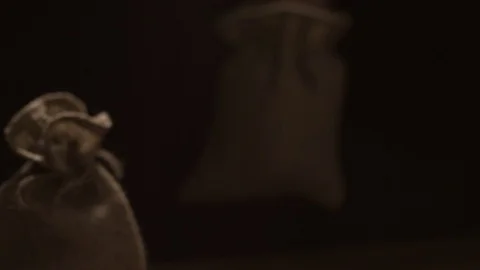 Coffee beans drop out of the bag close-up Stock-Footage 75442863