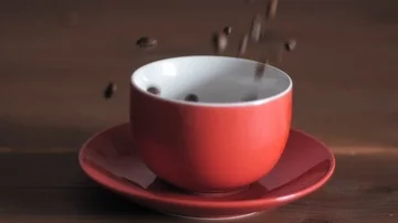 Coffee beans dropping into cup part1 Stock Footage 85806215