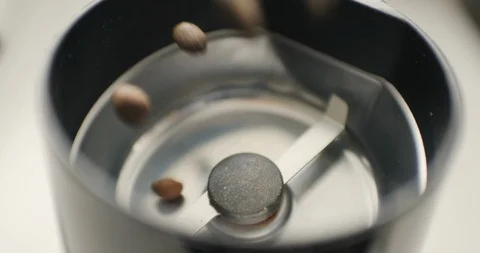 Coffee beans drops in the grinder Stock Footage 104406362