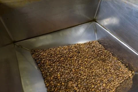 Coffee beans during the roasting process. Drum type roaster. Rosting process  Stockfoto's