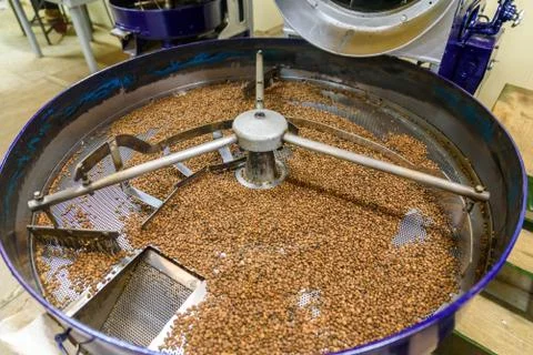 Coffee beans during the roasting process. Drum type roaster. Rosting process  Фото