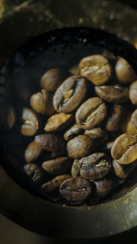 Coffee beans during roasting in viewing chamber Stock Footage 310540954
