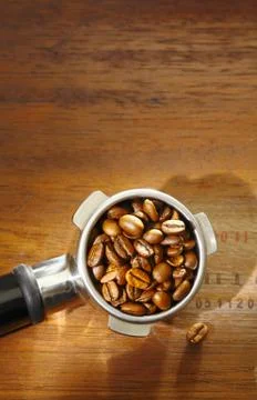 Coffee beans in an espresso filter Stock Photos
