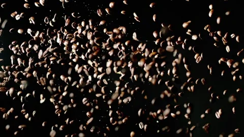 The Coffee Beans Explode Into The Dark Room Stock Footage 254998755
