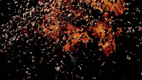 The Coffee Beans Explode With Fire Into The Air Stock Footage 254998791