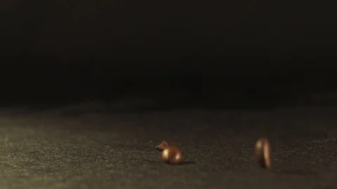 Coffee beans fall on the black surface Stock Footage 102420931