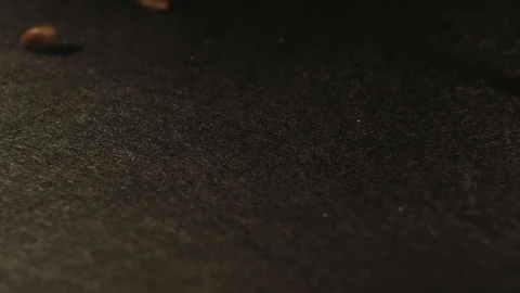 Coffee beans fall on the black surface Stock Footage 102420976