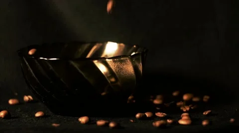 The coffee beans fall into the bowl Stock Footage 64344840