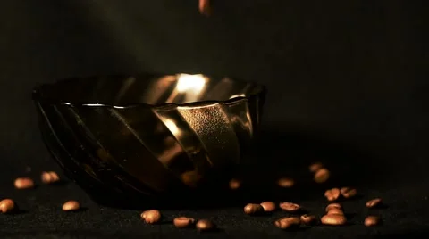 The coffee beans fall into the bowl Stock Footage 64344841