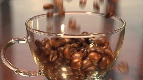 Coffee beans fall into the cup. Slow motion. Stock-Footage 55298909