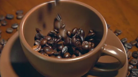Coffee beans fall into the cup. Slow motion 240 fps Stock-Footage 55821896