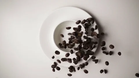 Coffee beans fall into a cup slow mo Stock Footage 73447768