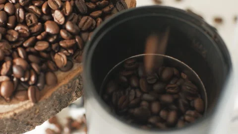 Coffee beans fall into the machine for grinding. Stock Footage 263062293