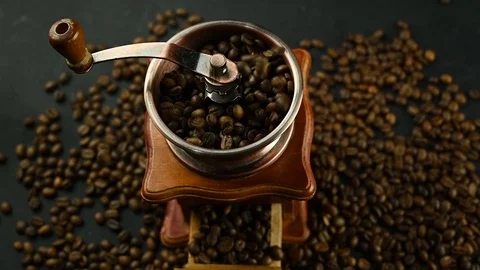 Coffee beans fall into the mill Stock Footage 127115344