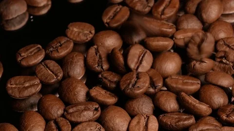 Coffee beans fall on the mirror Stock Footage 74775345