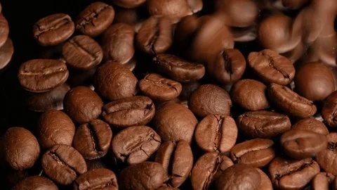 Coffee beans fall on the mirror Stock Footage 74775441
